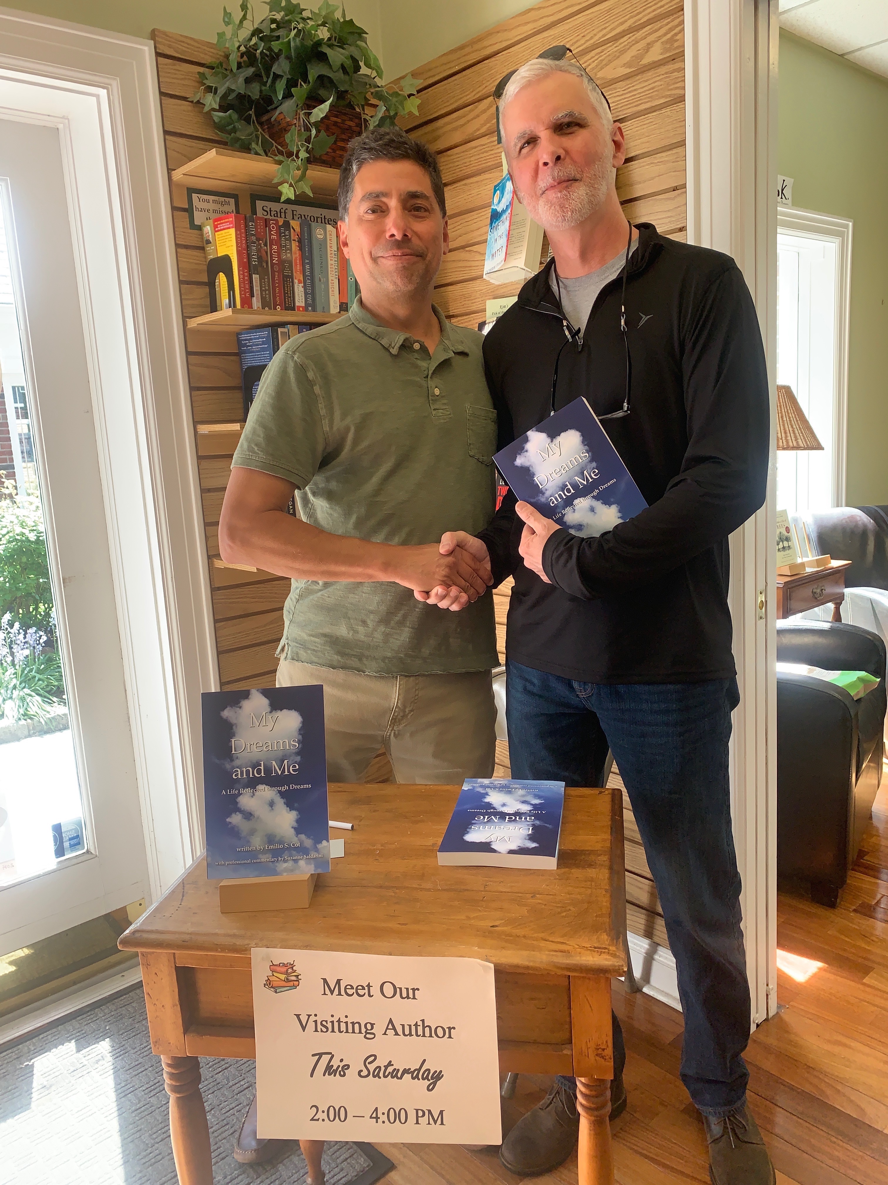 Emilio poses with attendee at Book Signing in Town Book Store