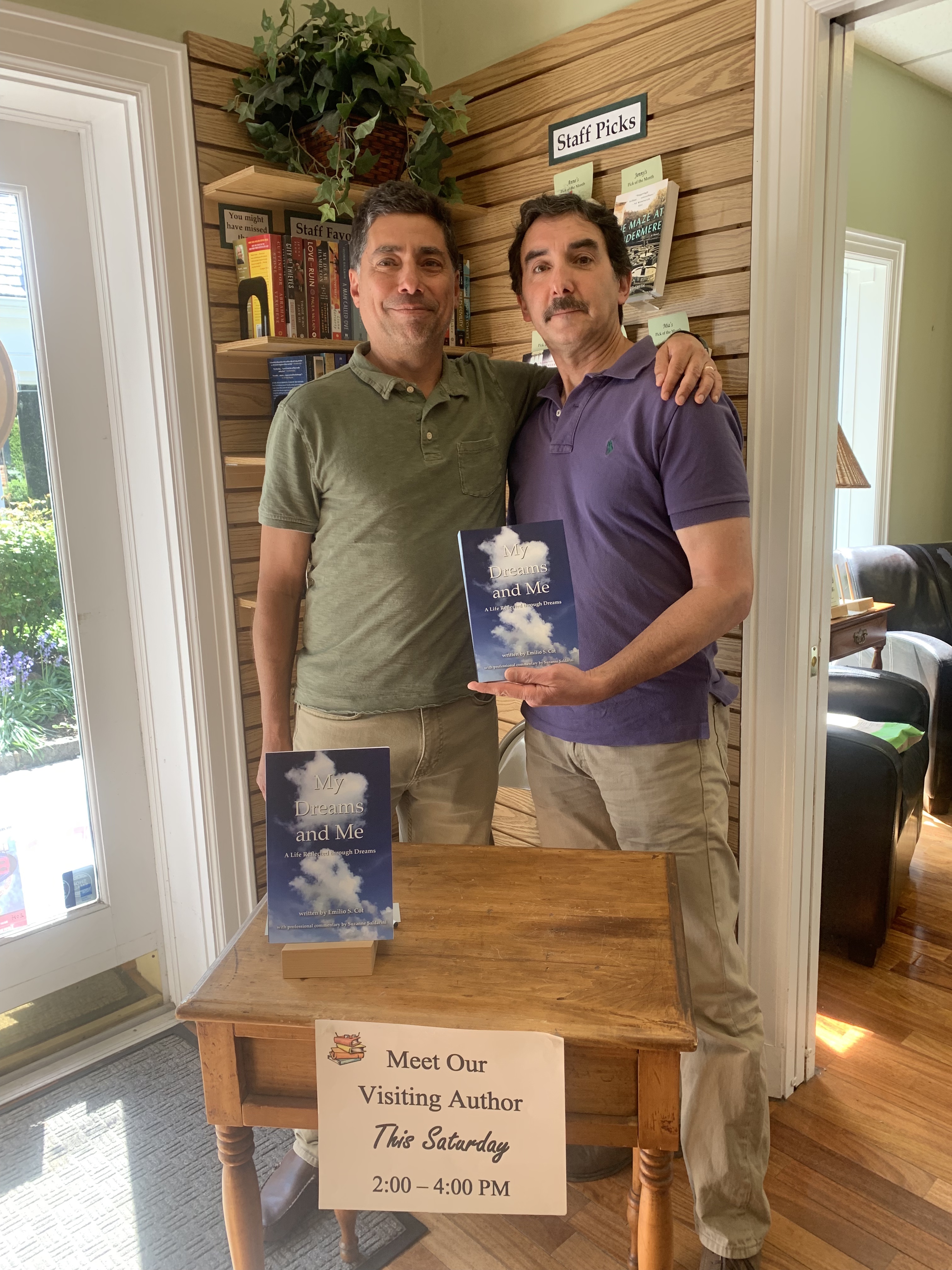 Emilio poses with attendee at Book Signing in Town Book Store